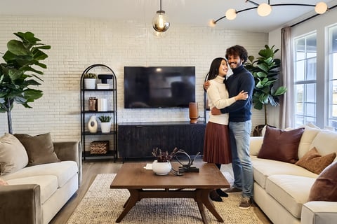 Family reviewing purchase agreement in Harvest Ridge living room