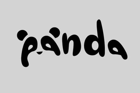 a black and white photo of a panda bear