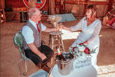 a man and woman are sitting at a table