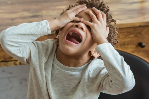 Image of boy in a state of panic and distress