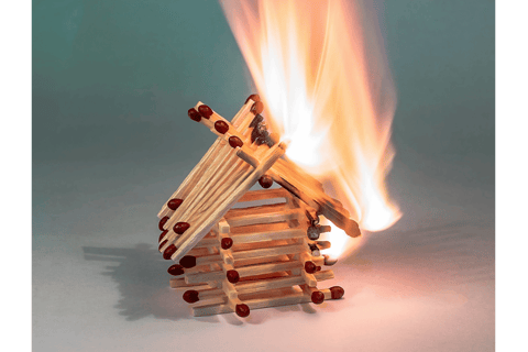 A house of matches burning down, a symbol of being triggered