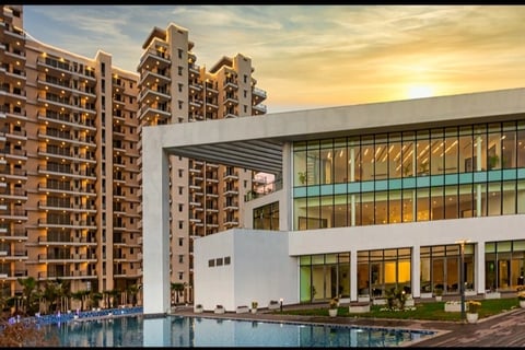 a large building with a pool and a swimming pool