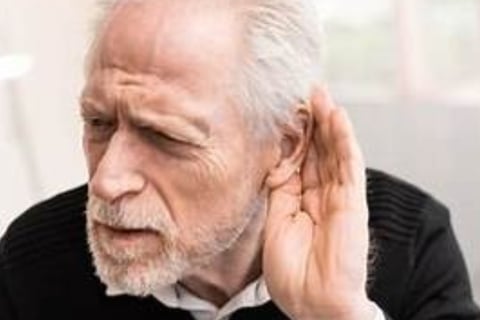a man with weak hearing