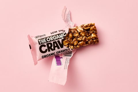 a Granola bar in a pink rapping