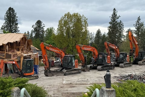 Five excavators in a row