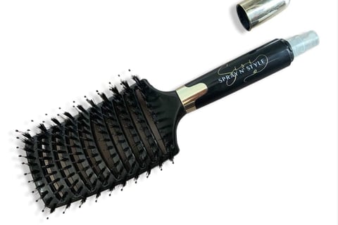 A picture of Sisi N’ Spray detangling brush designed for gentle, effective hair care.