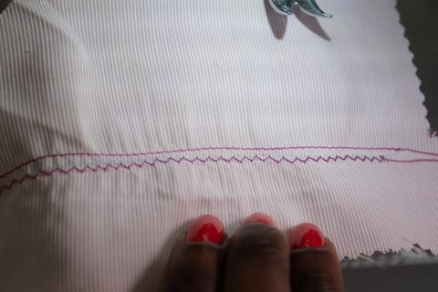 Overlock stitch on pink fabric