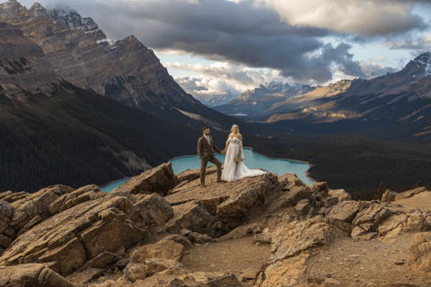 Couple holding hands at Peyto Lake during their elopement