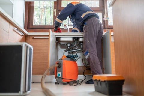 plumber cleaning your drain