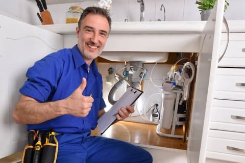 plumber is happy to see everything under the sink is working great