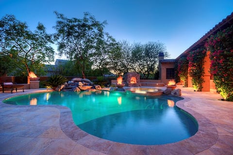 a pool with a waterfall