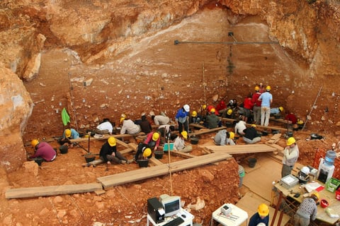 Scientist near the cave at the Sima del Elefante site