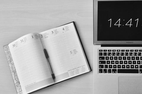 a laptop computer and notebook with a notebook and a notebook