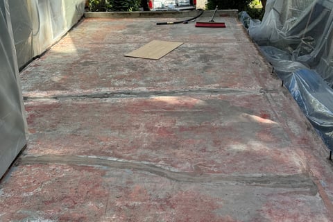 Layers of Paint and sealer on a 1930's concrete roof