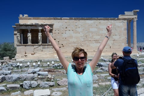 Lady Michelle celebrates making it atop the Acropolis in Athens, Greece