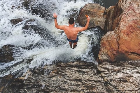 jumping into jacuzzi hole at Mkambati Falls