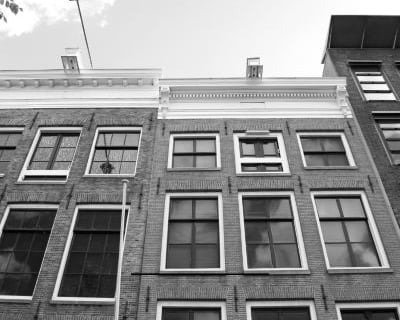 a black and white photo of a building with windows