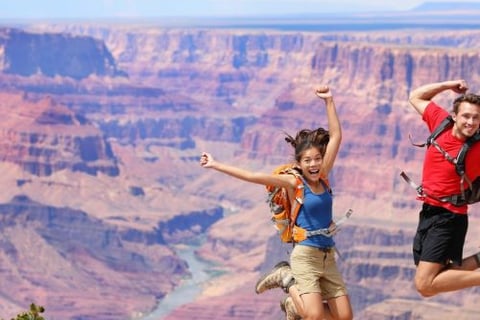 a couple of people jumping in the air