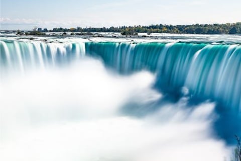 a waterfall in the middle of a large waterfall