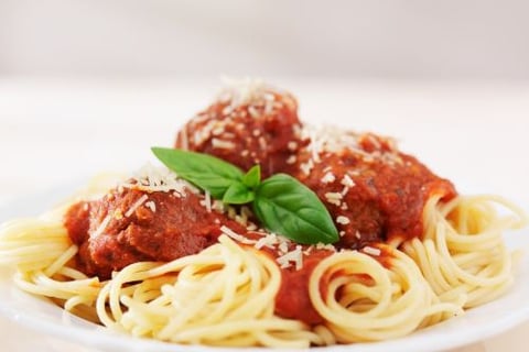 a plate of spaghetti sauce with spaghetti sauce and meatballs
