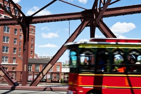 a bus driving over a bridge over a bridge