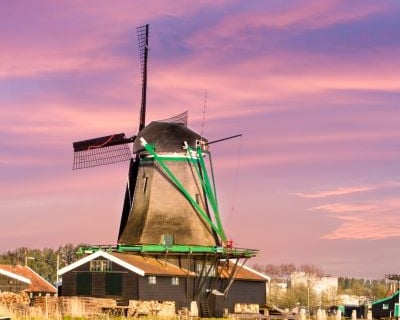 a windmill windmill in the middle of a river