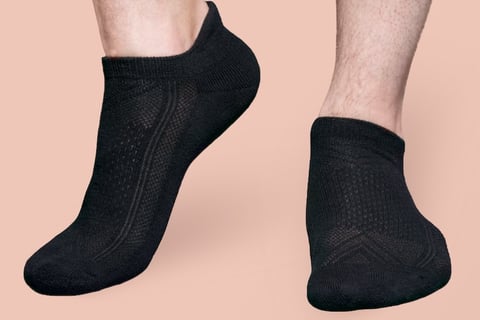 a man in a black ankle sock