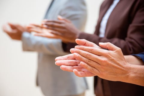 Hands of business people applauding speaker.