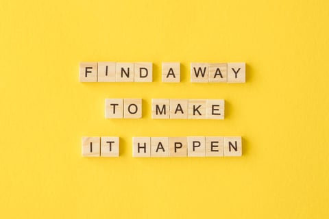 Motivational text on yellow background.