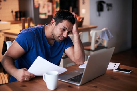 Man using a laptop at home.