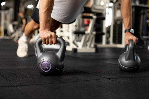 Close up kettlebells workout at gym