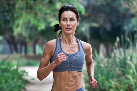 a woman in a sports bra top running