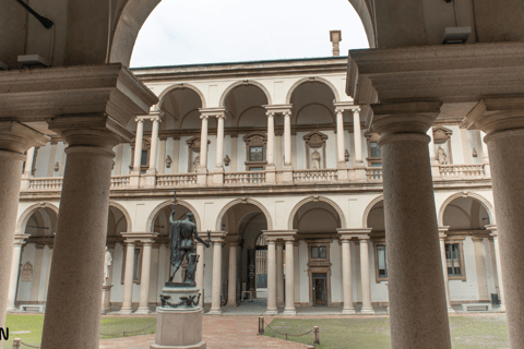 a statue of a man in front of a building