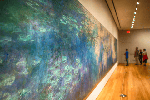 a large painting of a painting of a woman in a blue dress