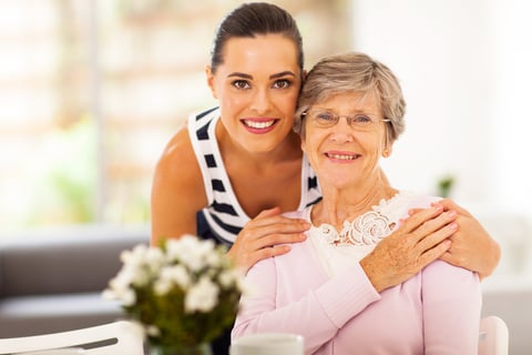 Private live-in cherished care carer with elderly mother while she is smiling