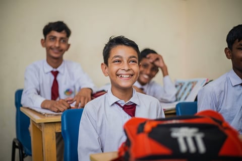 KIDS LEARNING IN OFFLINE CLASS IN A CHEERFUL MOOD