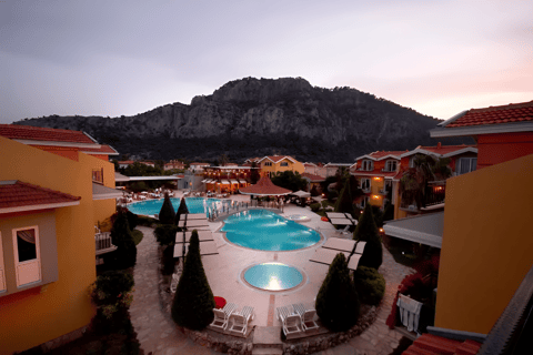 a pool with a mountain in the background in marmaris, turkey