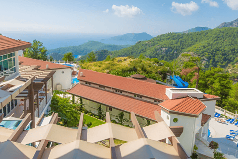 a view of a resort with a pool and a view of the ocean in marmaris, turkey