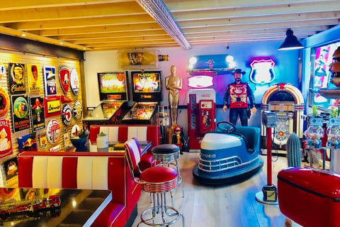 a room with a lot of arcade machines,arcade machines