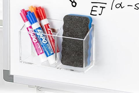 a whiteboard with a magnet marker and eraser holder