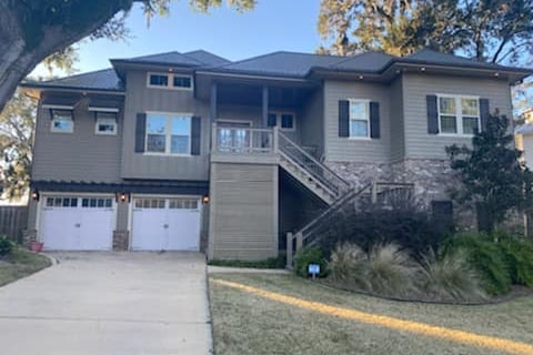 a house with a driveway and garage door