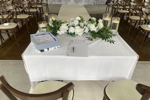 Beginning of Wedding Ceremony With Script and Certificate on a Table