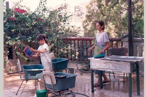 Chava teaching her granddaughter the craft of papermaking