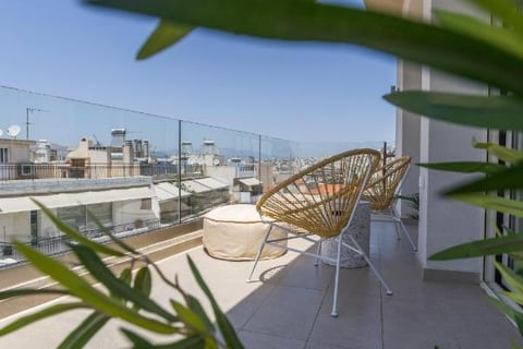 spacious glass outside balcony, 2025, wooden chairs, minimalist style, marina zeas apartments