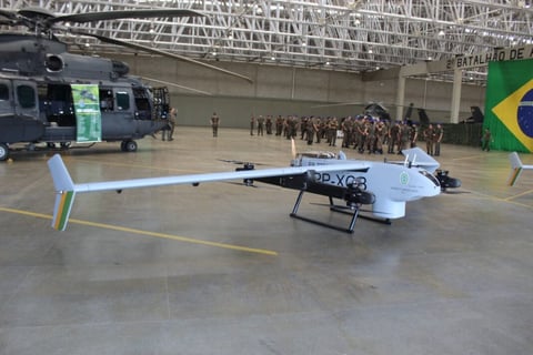 a helicopter with a flag on it in a hangar drone nauru 1000c