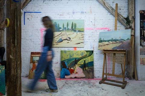 Fruzsina Bognar walking through her paintings in the studio