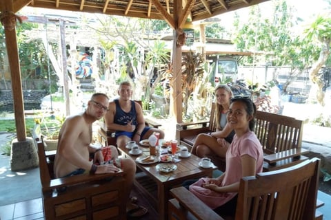 a group of people sitting around a table enjoying breakfast at sunrise lodge and lounge