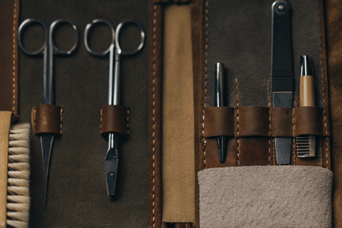 A collection of essential cat grooming tools displayed on a white background.