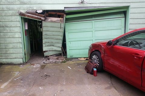 Fix garage door crashed into by car.