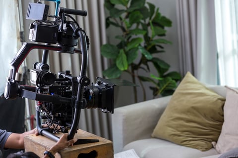 a man is holding a camera and a camera